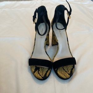 Black and gold open-toe block heel.